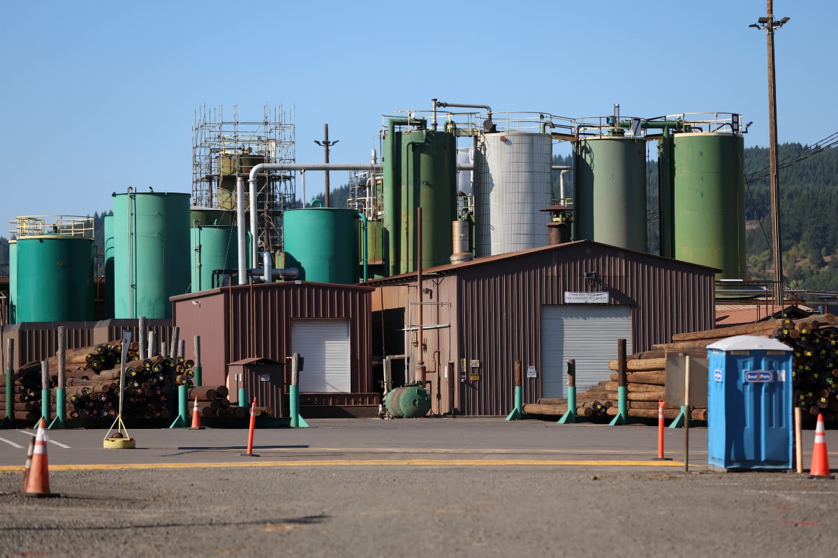 An Oregon wood treater kept polluting a town’s water source with a now-banned chemical — but regulators didn’t stop it