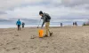 Joseph Lopez of Seattle and other volunteers collected marine trash at Golden Gardens Park in Seattle.