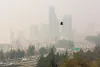 Wildfire smoke obscures the view of the Seattle skyline in a view from the Jose Rizal Bridge, Friday, September 11, 2020.
