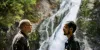 Framed by Cedar Falls, Seattle Public Utilities water-planning director Alex Chen talks with Ralph Naess, the utility's