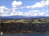 This view from Crown Point in Oregon  showcases the rolling farmlands of Washington in front of the Cascade Mountains, which