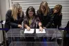 Observers from the Republican Party compare sample data, looking for disparities during a ballot-counting test at the