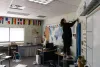 Caitlin Tumlinson, a teacher at Lakeside High School in the Nine Mile Falls School District near Spokane, prepares her