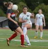 Naomi Whitlock of David Douglas absorbs a ball to the face after a kick by Century’s Angela Silva goes unexpectedly high off