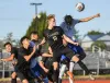 Canby’s Joe Thompson and Gresham’s Joel Gonzalez go into the air to play a header during a preseason match.