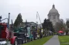 Dozens of logging trucks parked in front of the state Capitol in Olympia March 2 as part of a show of force by loggers and