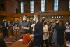 Candidates and their families watch names scroll across three large screens in the Oregon House chamber on Tuesday, March 8,