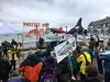 Protestors gather at a Seattle rally against proposed funding cuts for Puget Sound restoration on March 22nd.