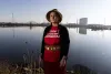 Tribal Councilmember Annette Bryan on tribal land across the water from the terminal, which sits on the edge of the Puyallup