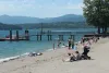 Tourists and locals alike enjoy a beach along the shores of Coeur d’Alene Lake near the resort in Kootenai County.