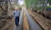 Marc Thalacker, the manager of Three Sisters Irrigation District, standing on a newly installed water pipeline