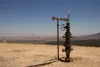An oil well head overlooking Red Valley and the Shiprock peak in New Mexico. It's designated as an actively producing oil