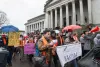 Protestors march outside the state capitol at a foster youth rally in Olympia on February 10, 2017.
