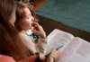 Sara Schultz reading with her son Keith Schultz-Davis, 7, at their home in Northeast Portland on Dec. 14, 2022. Keith has