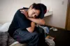 Antonio Torres, 23, sits in his room at a temporary housing unit in Seattle's University District on October 3, 2010.