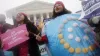 Demonstrators supporting access to birth control stand outside the U.S. Supreme Court in Washington. Oregon and California