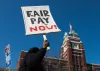 Several hundred Starbucks Workers United union members and supporters gather at the Starbucks headquarters Wednesday, to