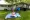 As her 2-year-old Zoey enjoys a picture book, Jessica Heavner throws a Frisbee with her son Joseph, 3, and daughter Alexia,