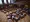 Democratic members of the Oregon Senate sit and stand around the mostly empty Senate chambers at the Oregon Capitol in