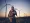 Standing before a row of the more than 2,900 industrial-scale wind turbines that tap the gales funneling through the