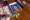 Bonnie Groo looks through portraits of her great-grandchild, Kit Nelson-Mora, in her home in Yakima, Wash., in November 2023.