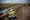 Construction workers specializing in pipe-laying work on a section of pipeline on July 25, 2013 outside Watford City, North