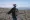 Rancher Edward Bartell stands by a fence blocking access to the Thacker Pass mine site outside of Orovada, Nevada, on March
